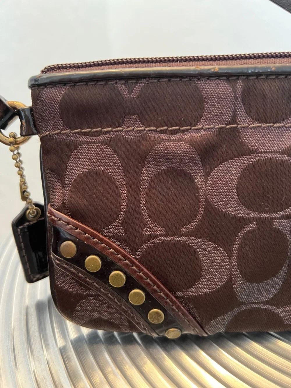 COACH EUC BROWN with BLACK PATENT WRISTLET